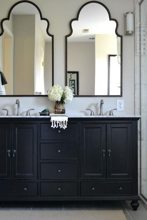 Best This neutral master bathroom features a beautiful black double vanity with bathroom vanity mirrors