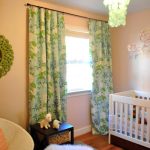 Chic baby girlu0027s pink nursery with colorful blue and green floral curtains  featuring nursery blackout curtains