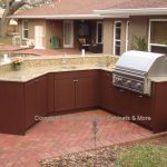 Chic Outdoor Kitchen Exposed To The Elements outdoor kitchen cabinets