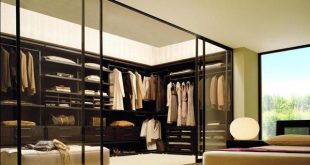 Chic Small walk-in closet design with round window bedroom with walk in closet