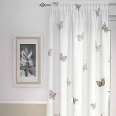 Chic The Butterfly Natural Net Curtain Panel has a white background with a white butterfly curtains