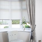 Compact Dressing a bay window by combining curtains and roller blinds creating a square bay window curtains