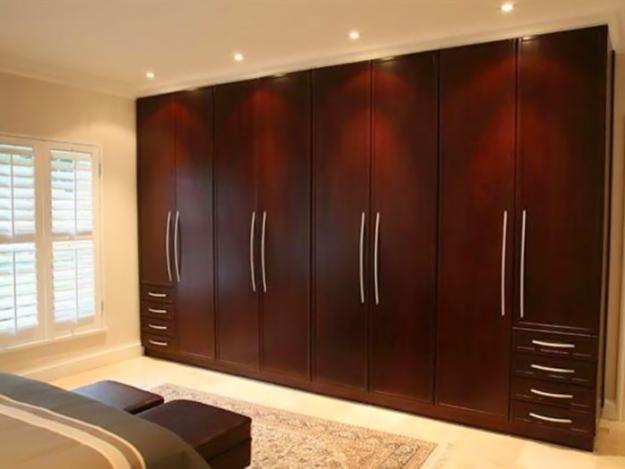 Contemporary Simple traditional wardrobe brown wooden design ideas woodwork designs for bedroom cupboards