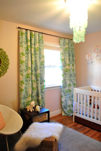 Cozy baby girlu0027s pink nursery with colorful blue and green floral curtains nursery blackout curtains