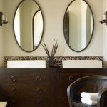 Cozy Green u0026 brown Mediterranean bathroom design with soft green walls, iron oval oval bathroom vanity mirrors