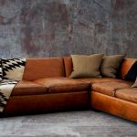 Cute leather sofa styled with brown and black pillows (RL home) leather sofa designs