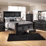 Elegant Cavallino King Mansion Poster Bed with Storage Footboard by Signature  Design black bedroom furniture sets