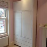 Elegant Free standing wardrobe, features include soft close draws and integrated  pull handles bespoke free standing wardrobes