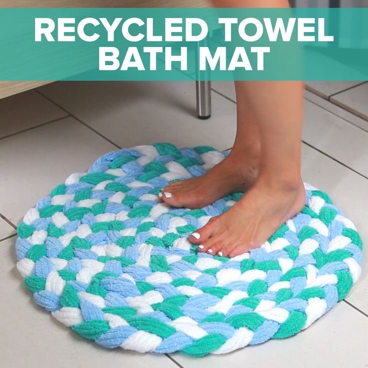 Master Braid old towels together to create this sophisticated bath mat! | Nifty braided towel rug