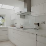 Photos of Minimal white gloss kitchen with solid surface worktops p white kitchen work tops