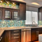Popular Farmhouse Sink Area in Cottage Kitchen glass tile kitchen backsplash