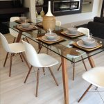 Popular Sticotti glass dining table and Eames dining chairs in walnut glass dining room sets