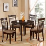 Stylish round kitchen table and chairs with brick wall and flower vase on round kitchen table and chairs