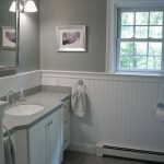 Unique New England bathroom design. Custom by PNB. Porcelain stone look tile, white white beadboard bathroom