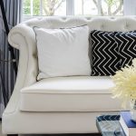 Chic White sofa with a white pillow and black pillow with white crooked white sofa pillows