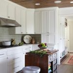 custom kitchen cabinets white transitional kitchen with gray subway tile backsplash IUHHTVC