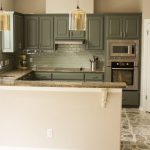 green painted kitchen cabinets with teal backsplash PMIIAJF