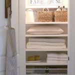 linen closets i love the sign and light and hook on the door UYFDMJO