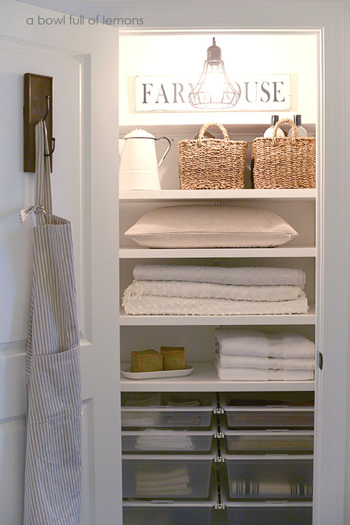 linen closets i love the sign and light and hook on the door UYFDMJO