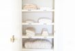 linen closets organize a hall closet with these easy tips from home blogger OTNBYPQ