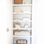 linen closets organize a hall closet with these easy tips from home blogger OTNBYPQ