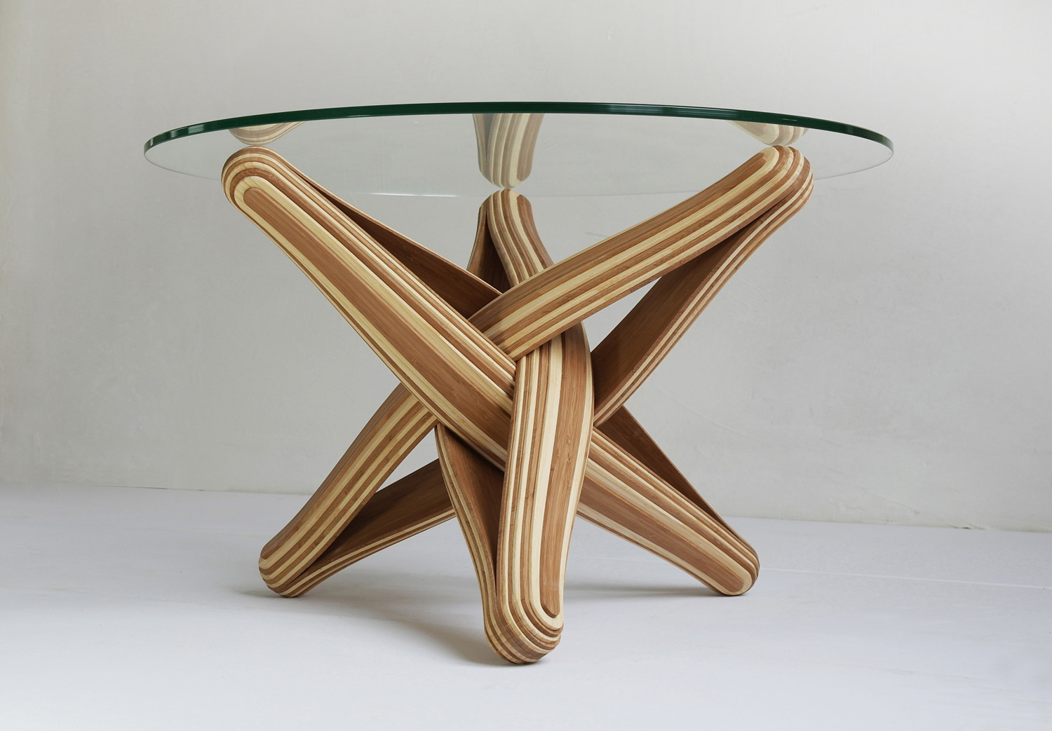 sustainable furniture lock is a bending, twisting coffee table made out of layered, TZCFDSX