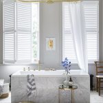 window treatment ideas these shutters are paired with lengths of fabric to soften the WSHBLFU