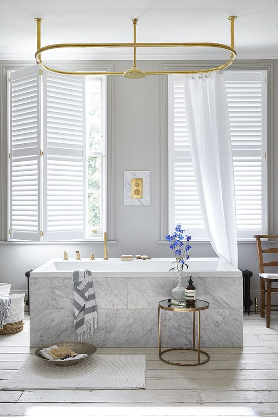 window treatment ideas these shutters are paired with lengths of fabric to soften the WSHBLFU