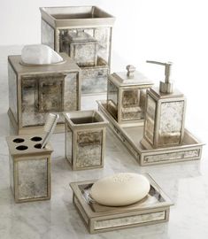 Beautifully coordinated set of bath accessories. The mirrored panels and  vintage look make for the