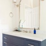 BLue Bath Vanity with Uttermost Kenitra Arch Wall Mirror