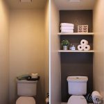 A dramatic water closet makeover with an accent wall and floating shelves  for storage! So easy and inexpensive!
