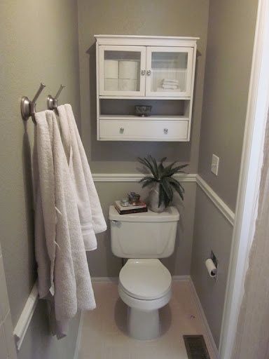 In each bath that has seperate water closetsmall water closet built-in  CABINET above toilet, to match that baths cabinetry. NOT SEE THRU DOOR,