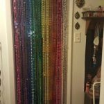 Mardi gras beads into a beaded door curtain.
