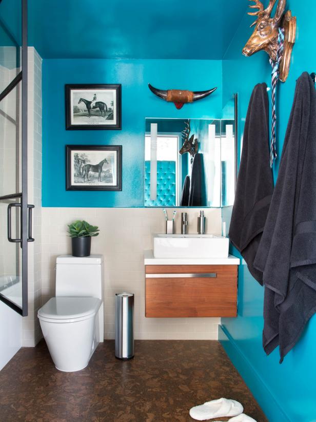 Modern Small Bathroom With Bold Teal Walls, Floating Vanity and Animal Wall  Decor