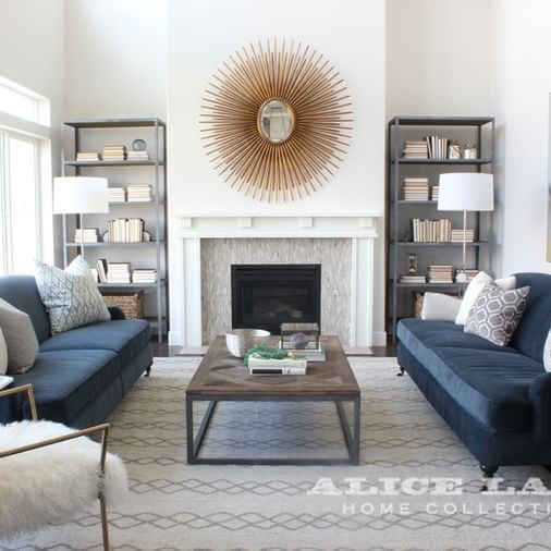 Alice Lane Home Collection | Living room with navy sofas and