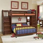 This immense dark stained wood frame bunk bed features the perpendicular  lower bunk design, built