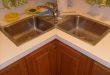 Give luxurious designs to modular kitchen with corner kitchen sink cabinet