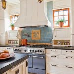 Here is another kitchen backsplash idea from French Country Cottage with  blue tile & white cupboards.