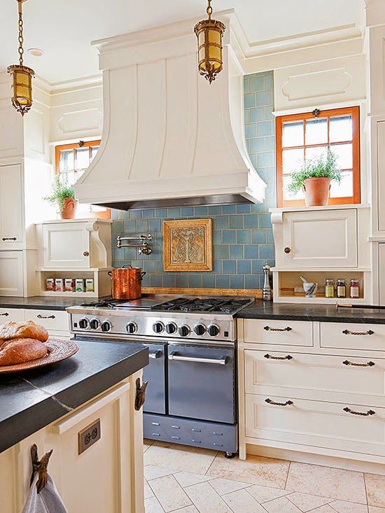 Here is another kitchen backsplash idea from French Country Cottage with  blue tile & white cupboards.