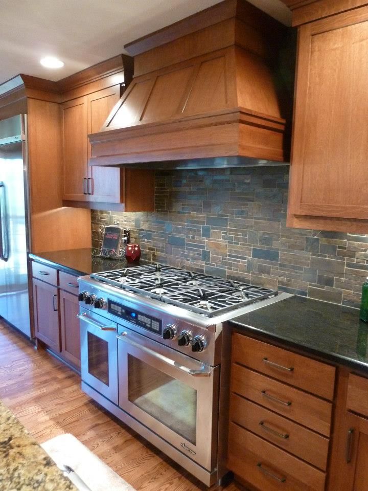 stone backsplash @Kitchens by Design Omaha