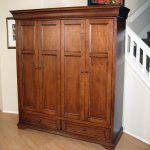 Hide your flat panel TV behind bi-fold pocket doors in the Tuscany Armoire