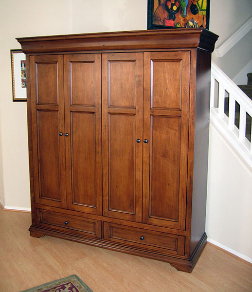 Hide your flat panel TV behind bi-fold pocket doors in the Tuscany Armoire