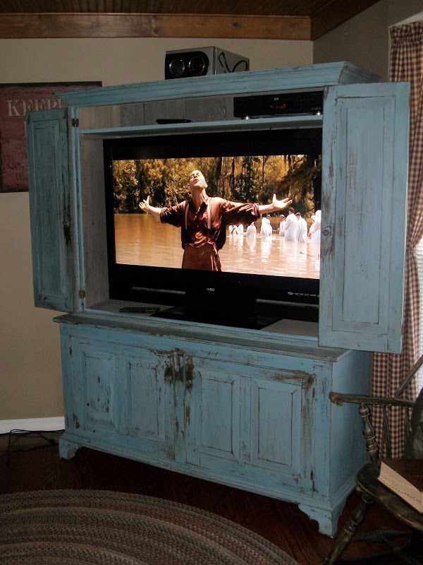 Flat screen tv armoire with pocket
  doors  for your home