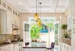 Incredible galley kitchen design with a long island! The wood grain runs  the length of the room making it feel even larger!