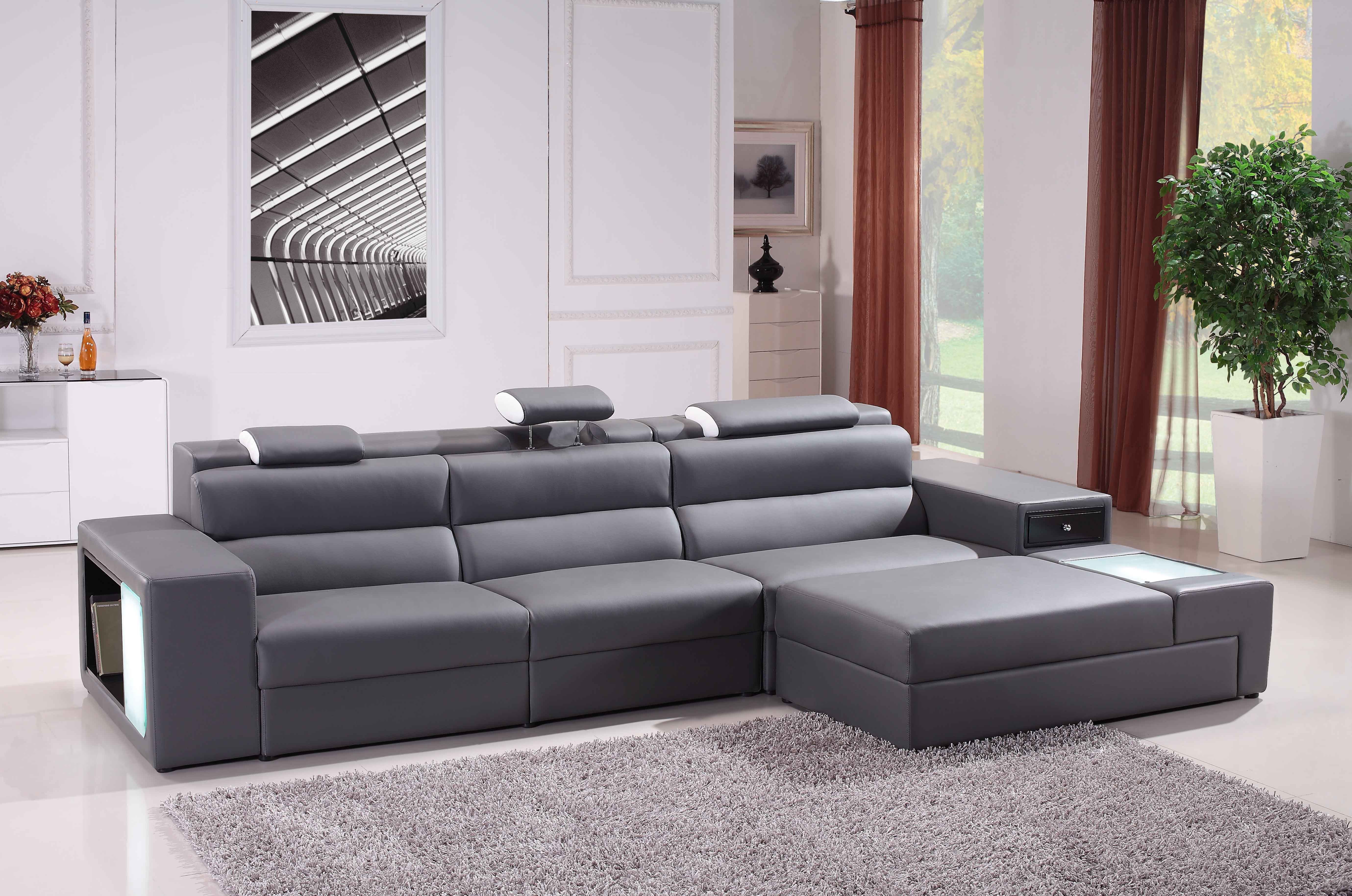 Gray Leather Sleeper Sectional Sofa With Shelf Placed On The White Floor  Plus Gray Fur Rug