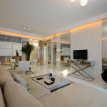 View in gallery Iconic decor and a neutral color palette in the living room  of the Shanghai apartment