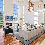 sun-filled living room with timber floors