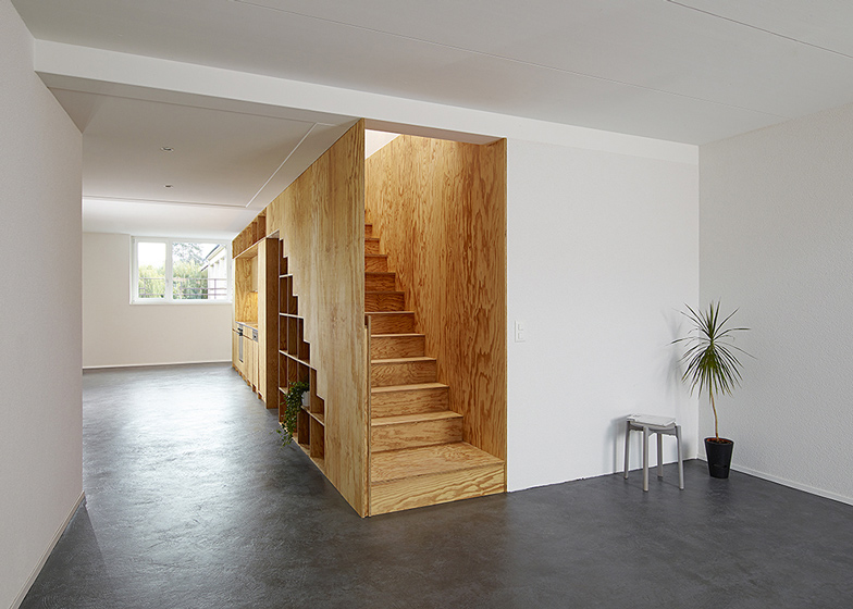 Eclépens apartment interiors with boxy wooden furniture by Big-Game