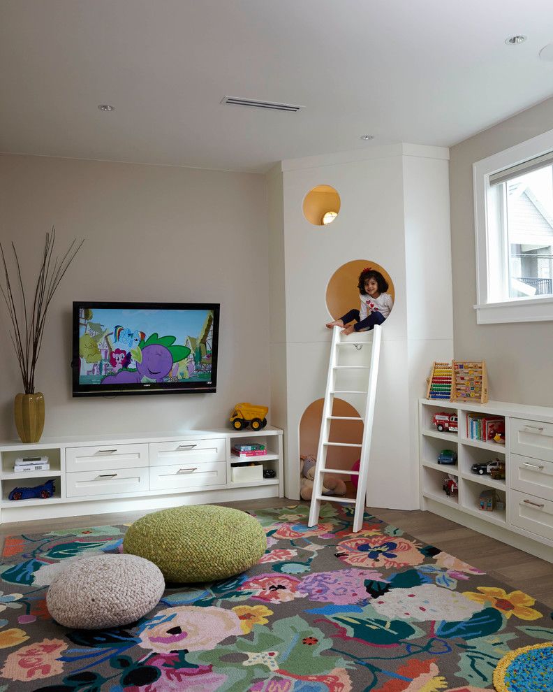 Kids playroom, large floral area rug, knit poufs, custom kids play house  with white ladder | MaK Interiors
