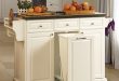 White Kitchen Cart With Trash Pull $279.99. Use for my folding center/extra  storage in the bathroom. Pull out as a hamper.